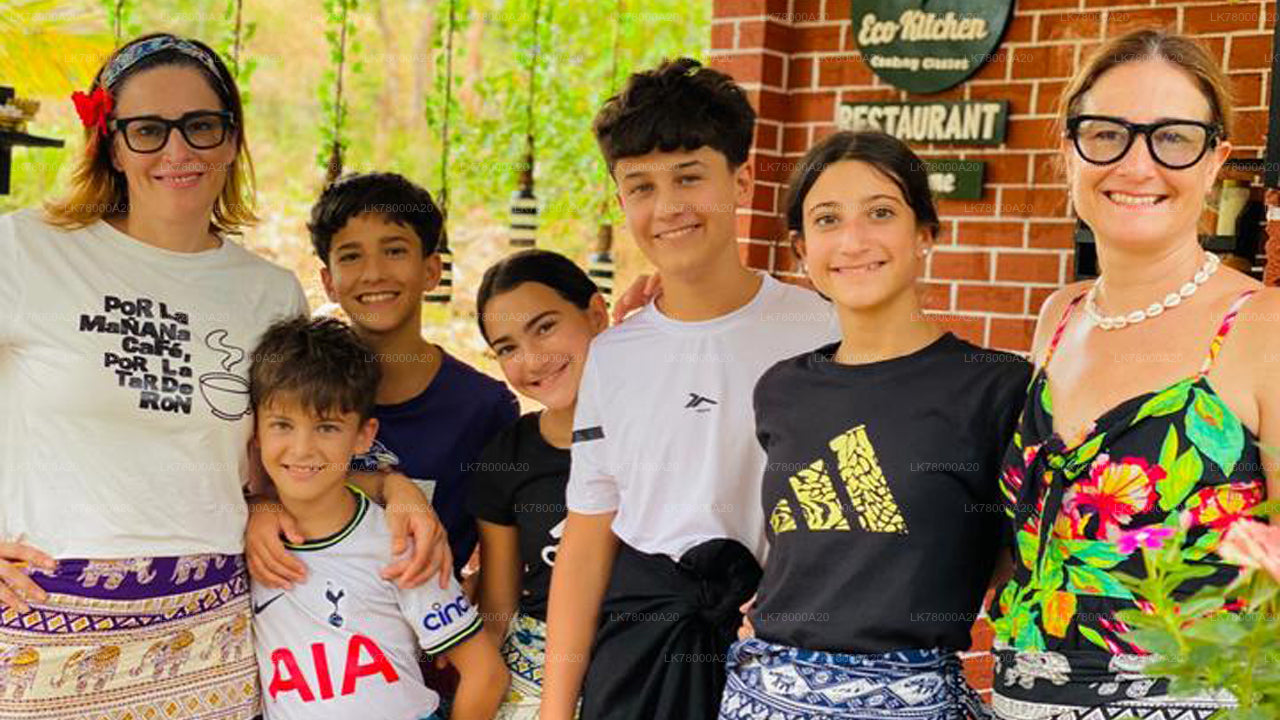 Family posing together in front of a restaurant entrance