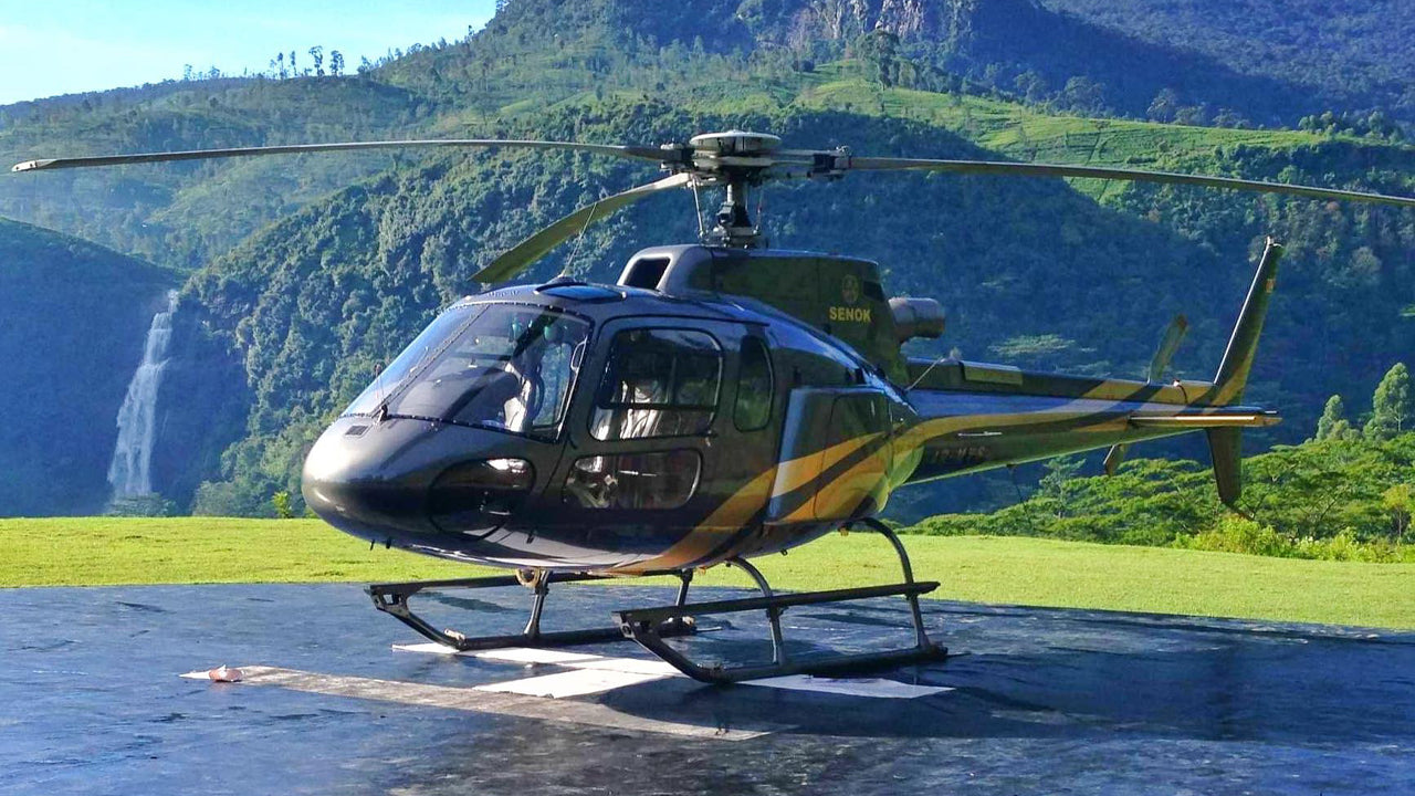 Helicopter on a landing pad with a scenic mountain background