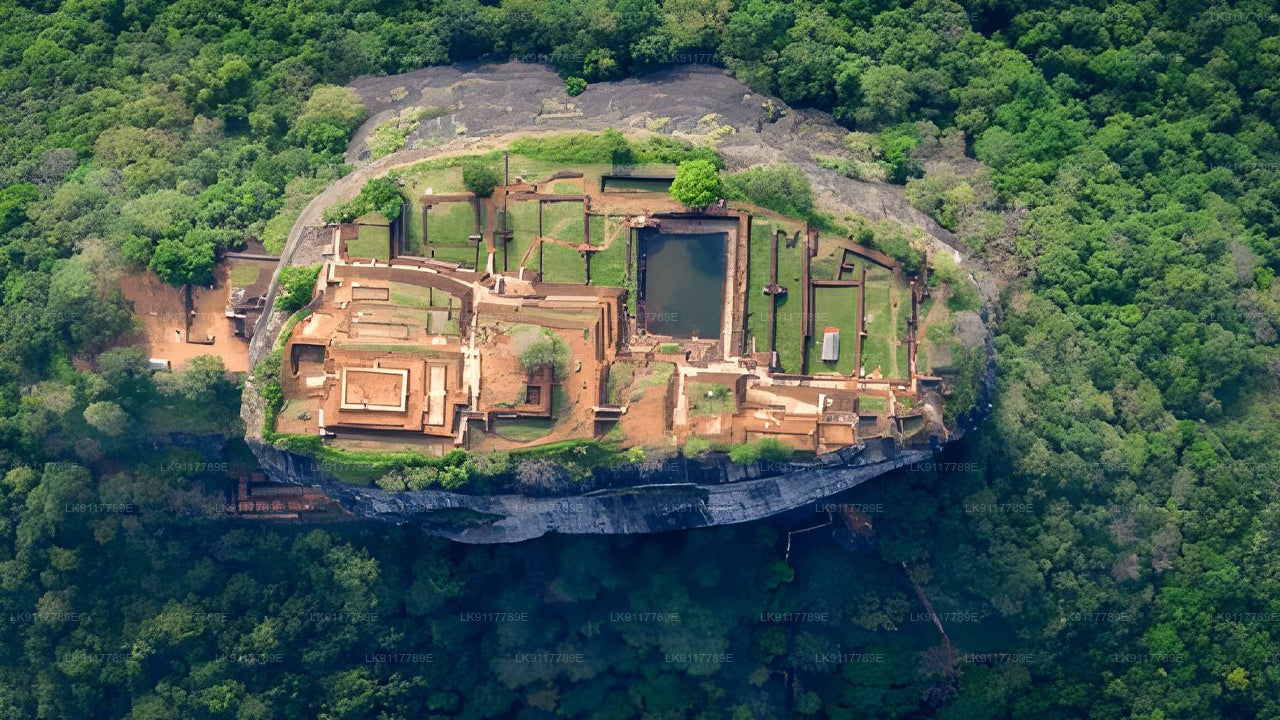 Aerial view of an ancient temple complex surrounded by lush greenery